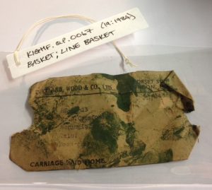 An old packing label found at the bottom of a basket, now placed in a conservation grade wallet and kept with the new object label