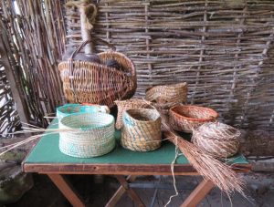 Some of Elaine’s straw-work baskets on show in the demo barn up at the township