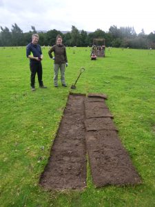 Sarah and Neil beginning to cut turf.