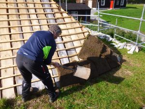 Neil starting to lay the turf onto the Blackhouse