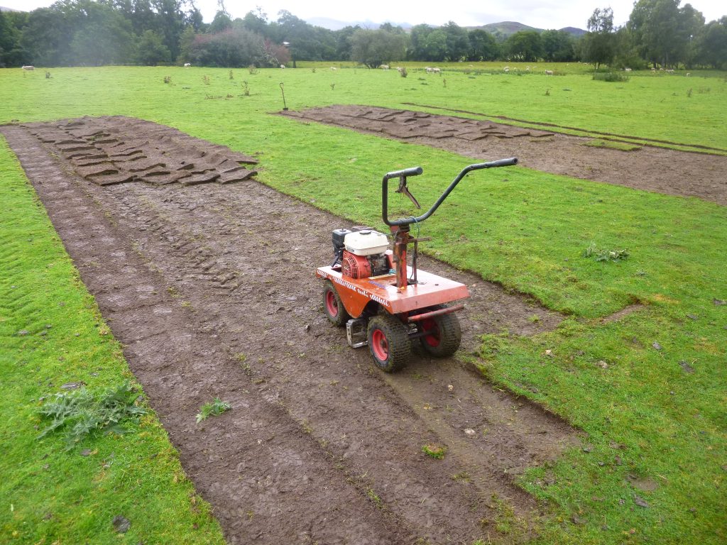 Cutting the turf Highland Folk Museum