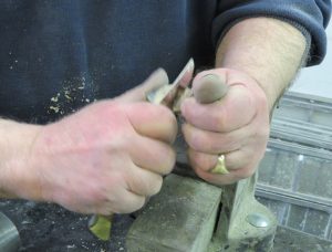 And demonstrating paring down the surface with a knife