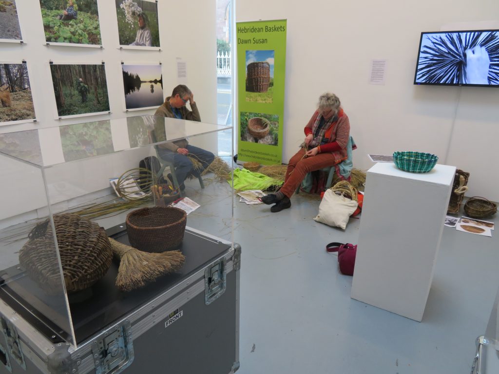 Dawn Susan and Stephanie Bunn doing some basket weaving in the gallery, inspired by the objects.