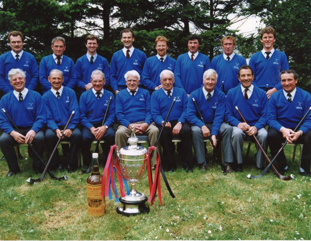 Newtonmore Camanachd Cup Winning Captains, gathered together at the Camanachd Association Centenary Cup Final day, 1996, in Fort William. Image courtesy of High Life Highland, Highland Folk Museum