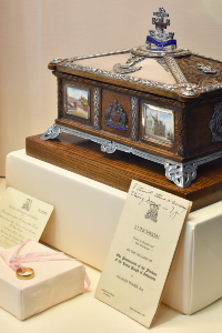 Freedom casket, invitations, and gold ring belonging to Charles Fraser.