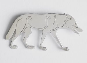 silver brooch in the shape of the Ardross wolf