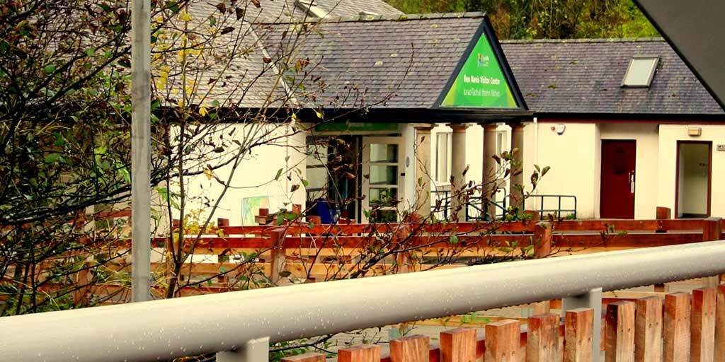 A photo of the Ben Nevis Visit Centre. It is a while building with a slate roof.