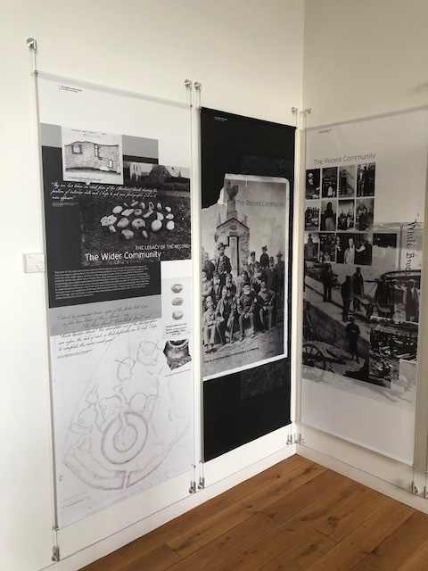 Three tall information panels about brochs arranged in a corner of the museum.