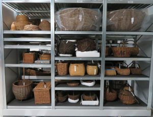 Metal shelving neatly filled with baskets organised by size and shape.