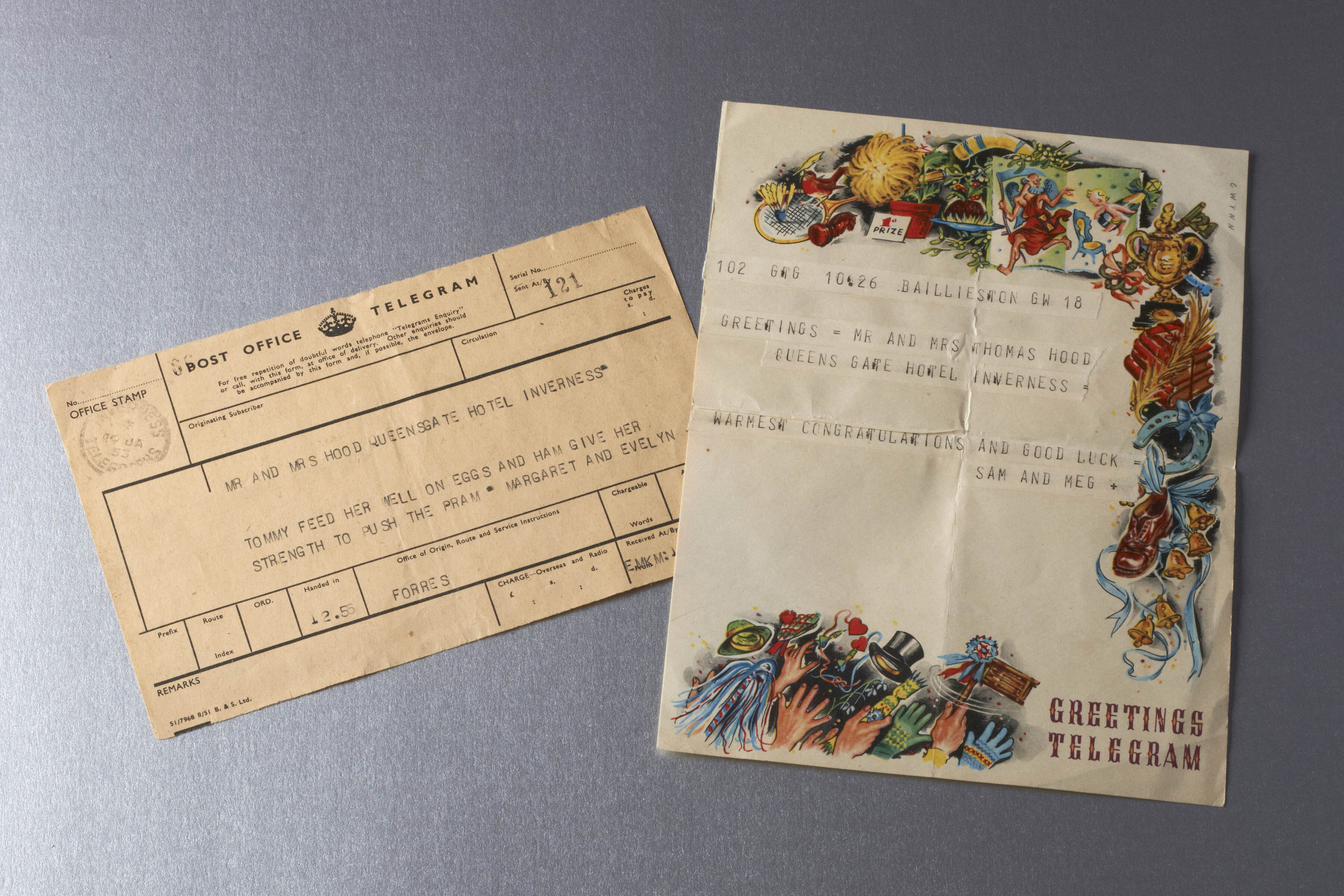 Two telegram documents, one plain brown, one cream with colourful decoration of wedding symbols, both featuring typed messages of good wishes to the happy couples.
