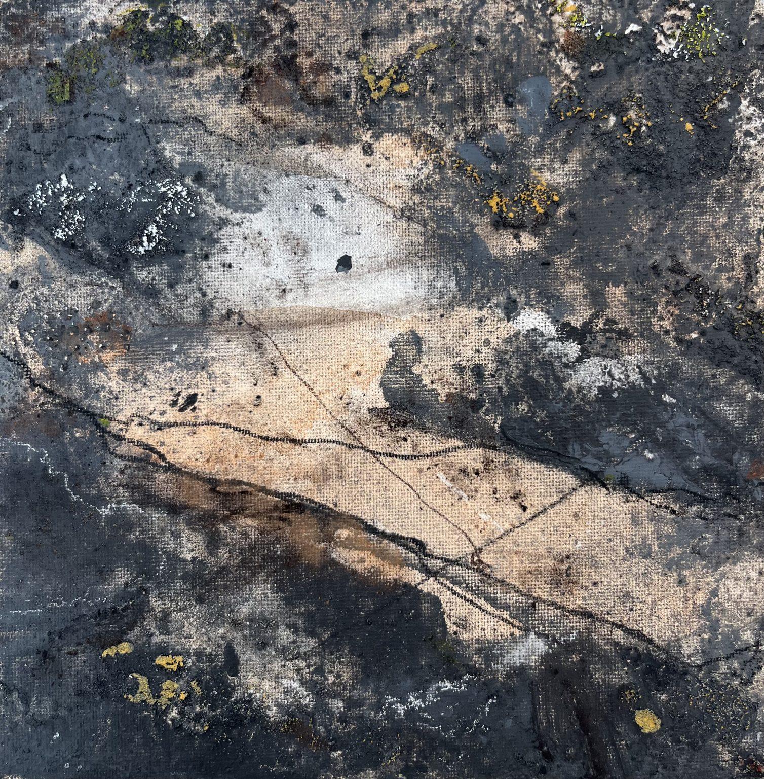 Abstract artwork titled "Às an Àirigh" by Eilidh MacKenzie, made with peat and peat ash on paper, featuring textured shades of black, gray, brown, and beige with organic shapes and scattered yellow-green patches.