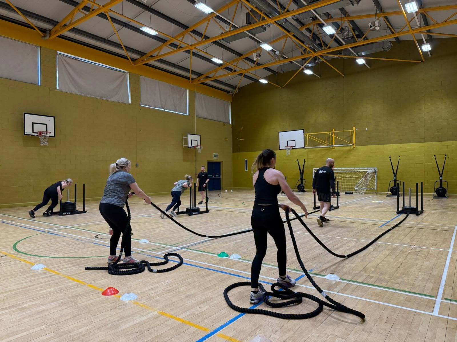 Participants training with battle ropes at Black Isle launch