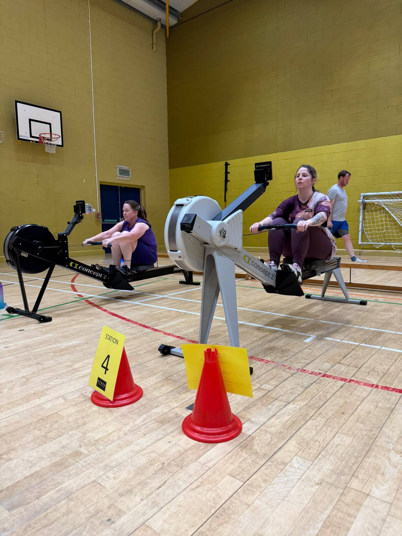Two women rowing side by side