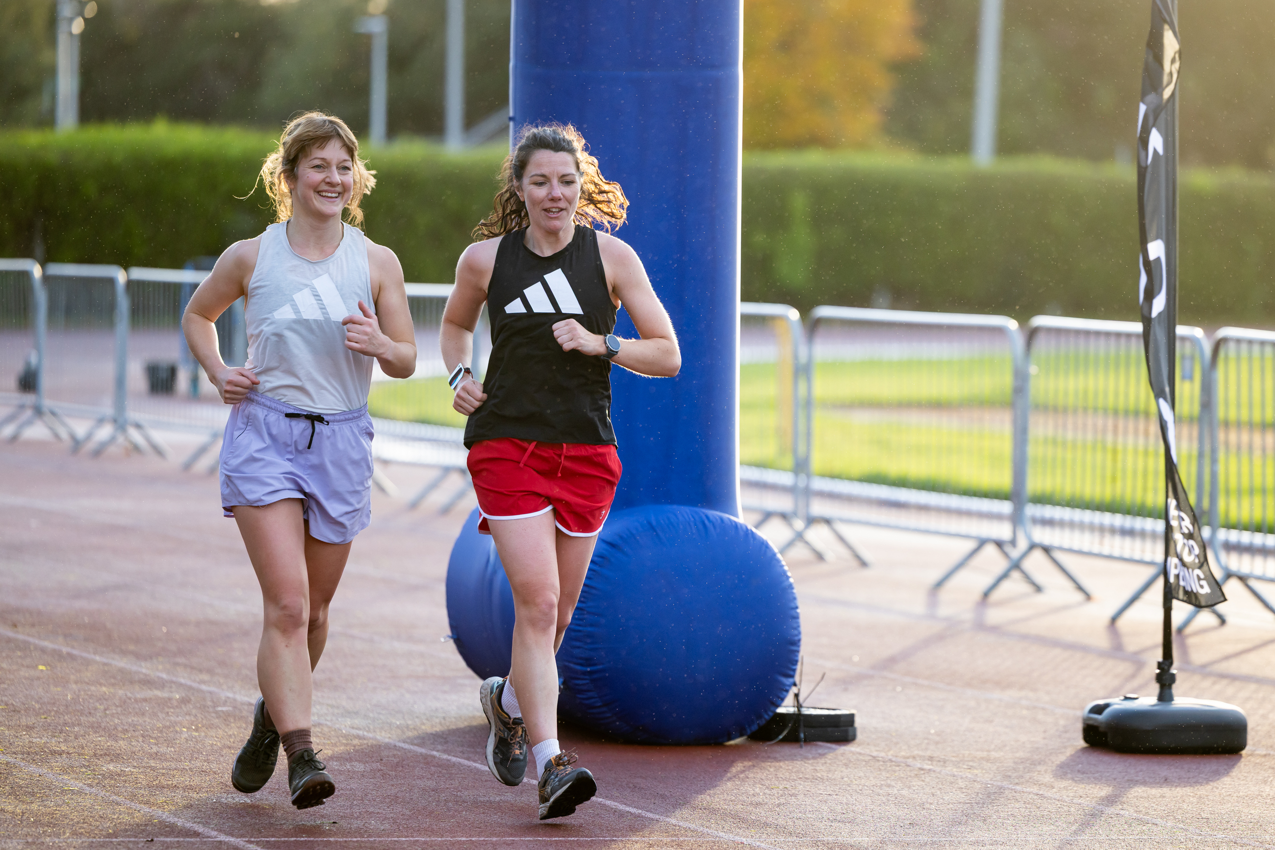 Two women finishing HYROX Sim event at Inverness Leisure