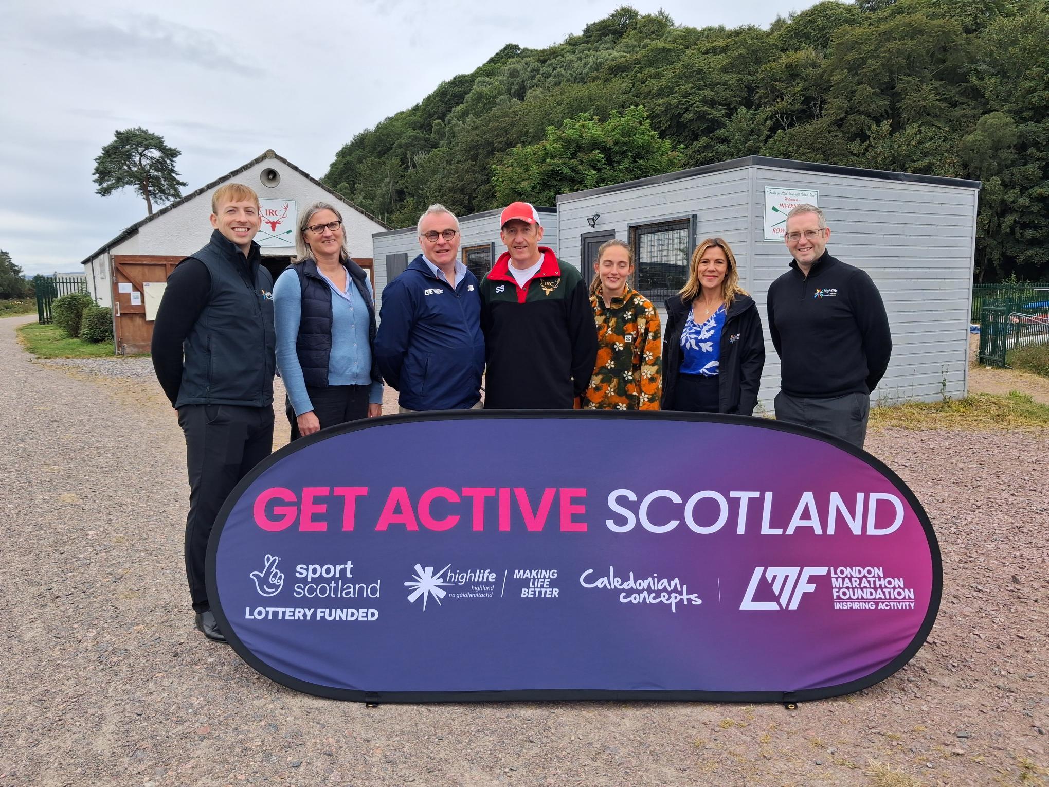Group with Get Active Scotland banner at rowing club