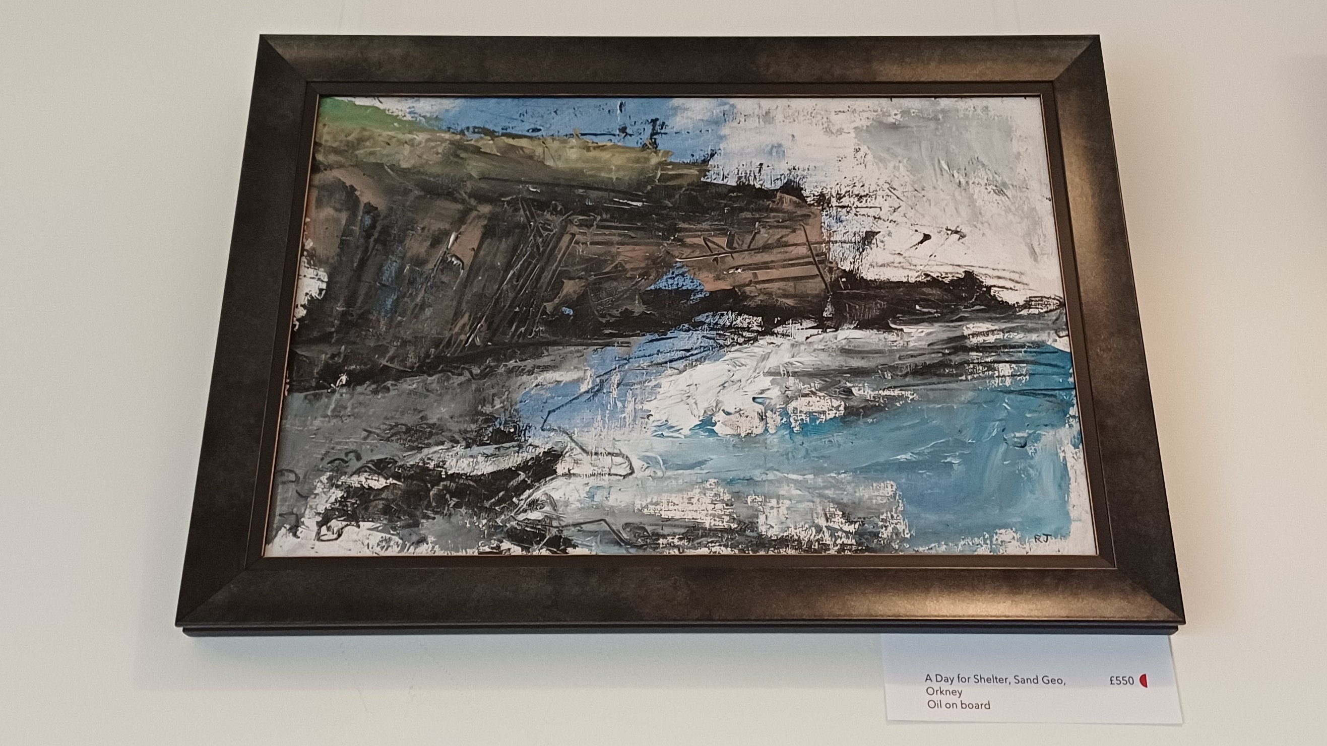 Framed painting of Orkney cliffs and sea