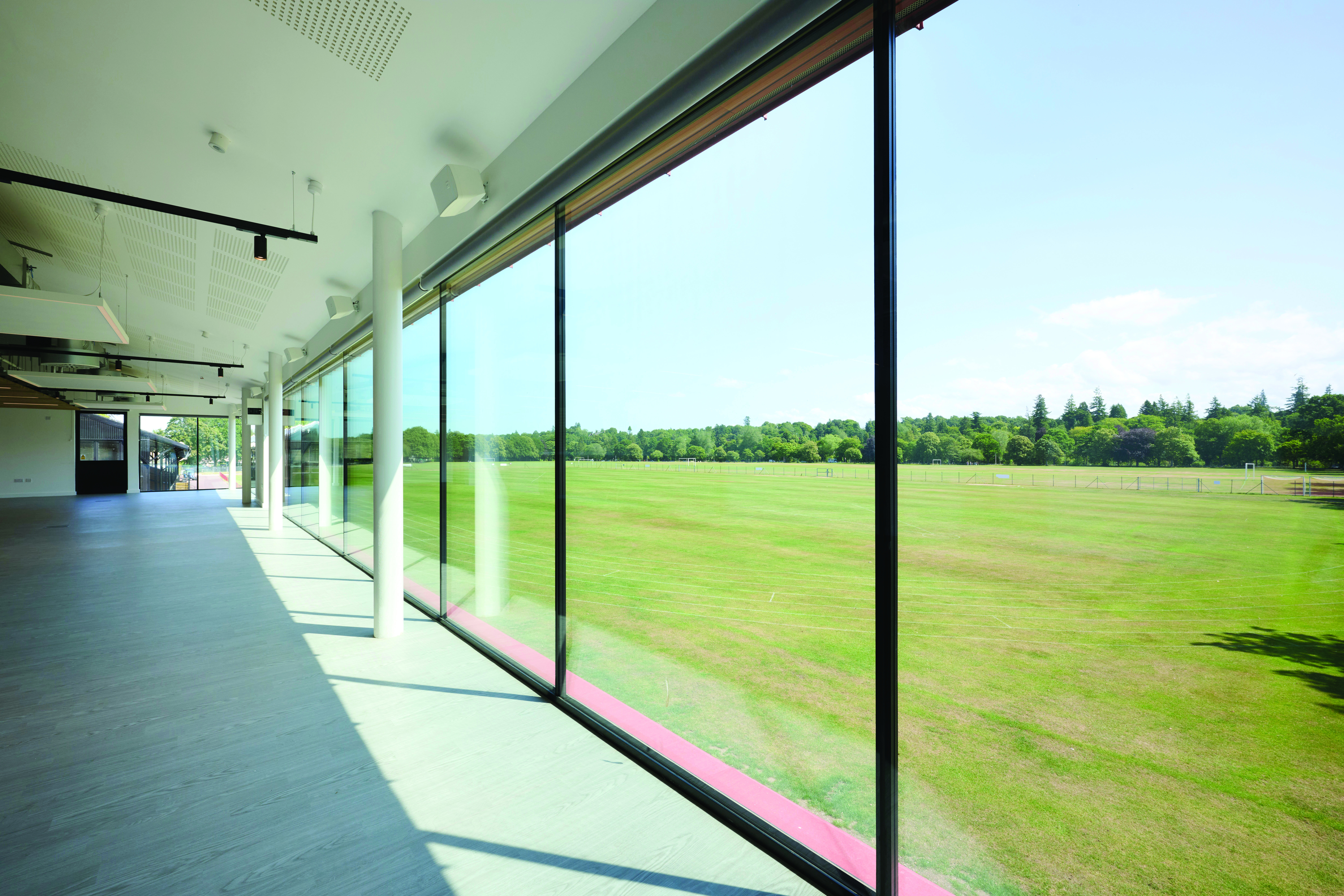 A view of the grass pitches and running track, taken from the Pavilion