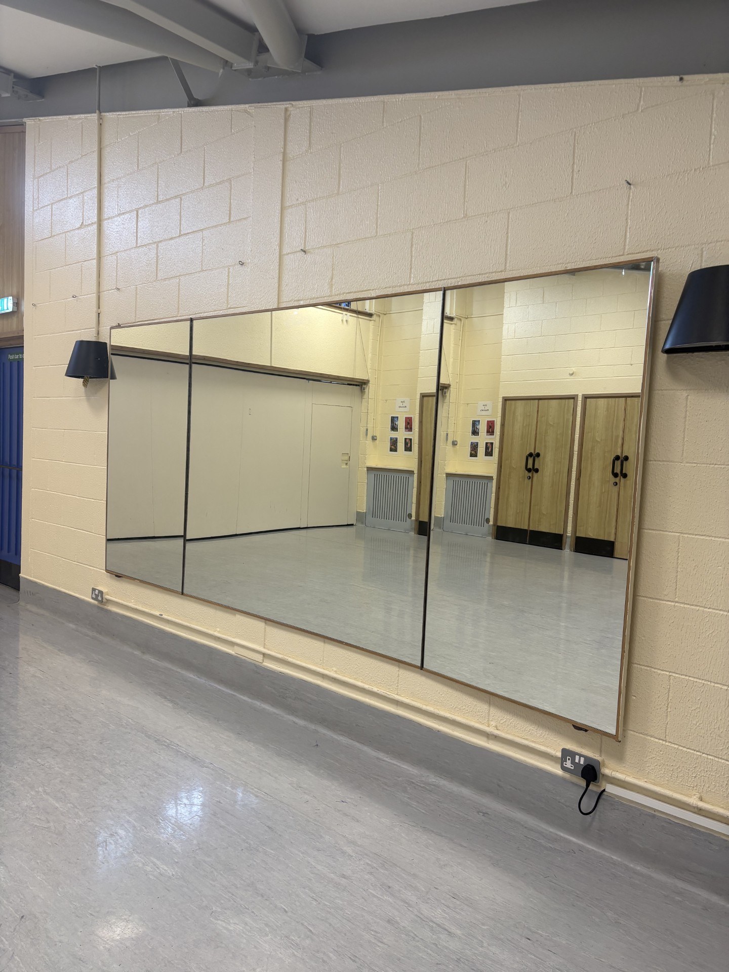 The Graham Ross Suite 1 features expansive wall-mounted mirrors.