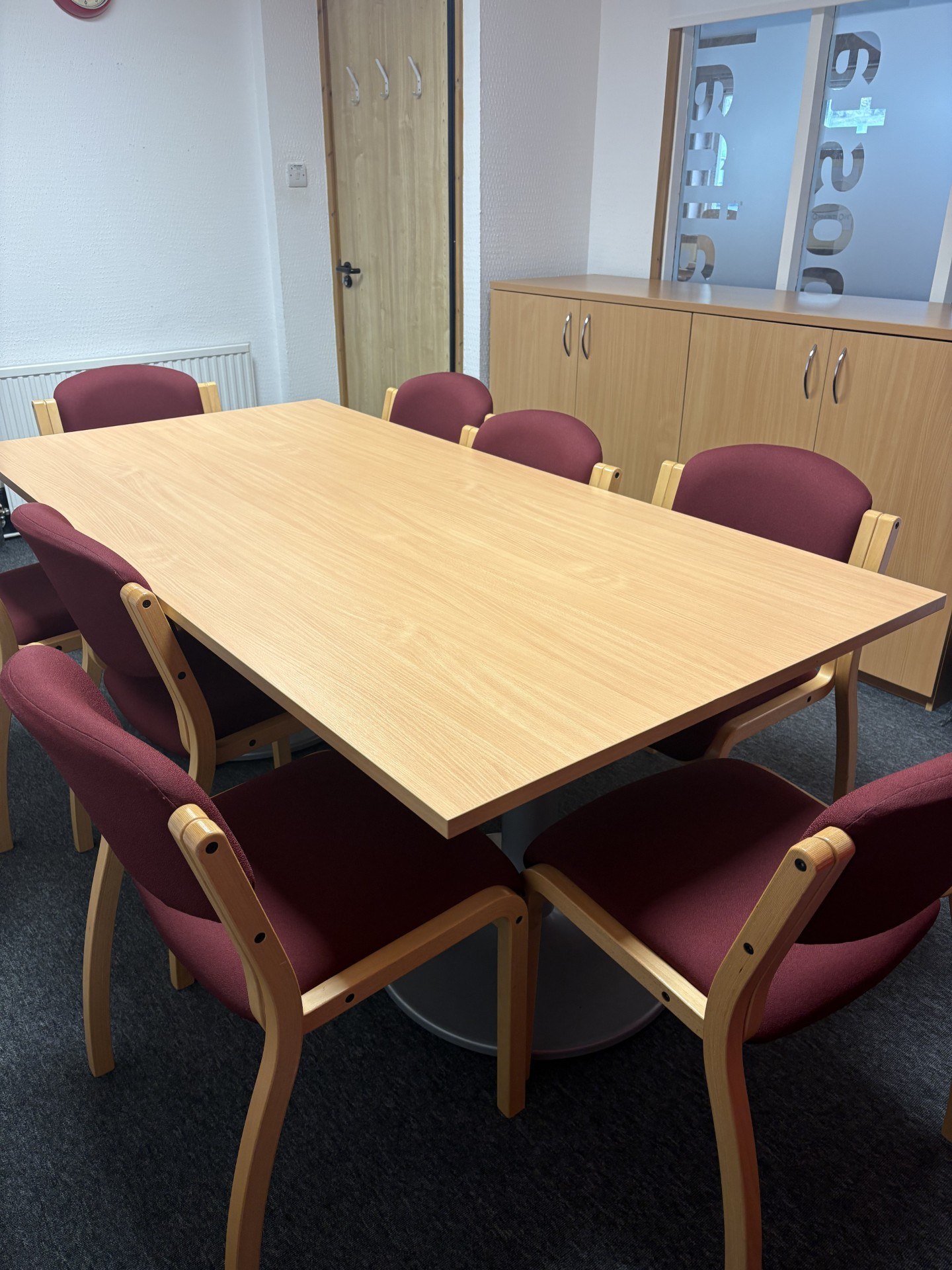 The Muir suite is equipped with a spacious conference table accompanied by eight chairs.