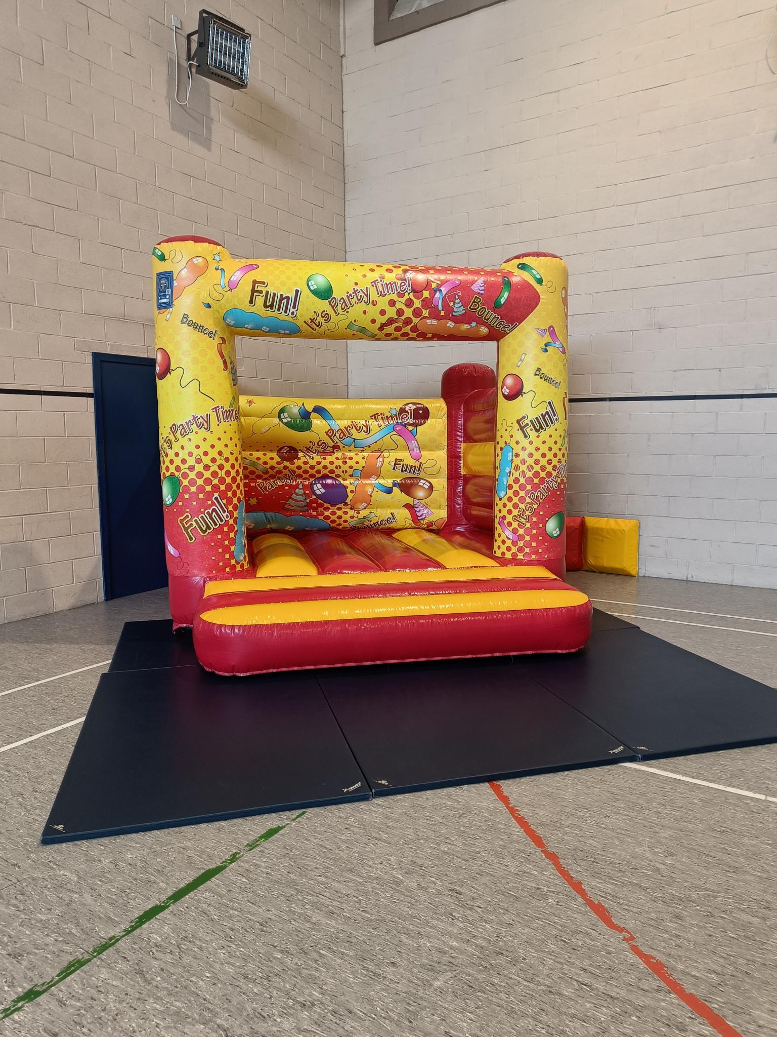 Bouncy castle in corner of hall