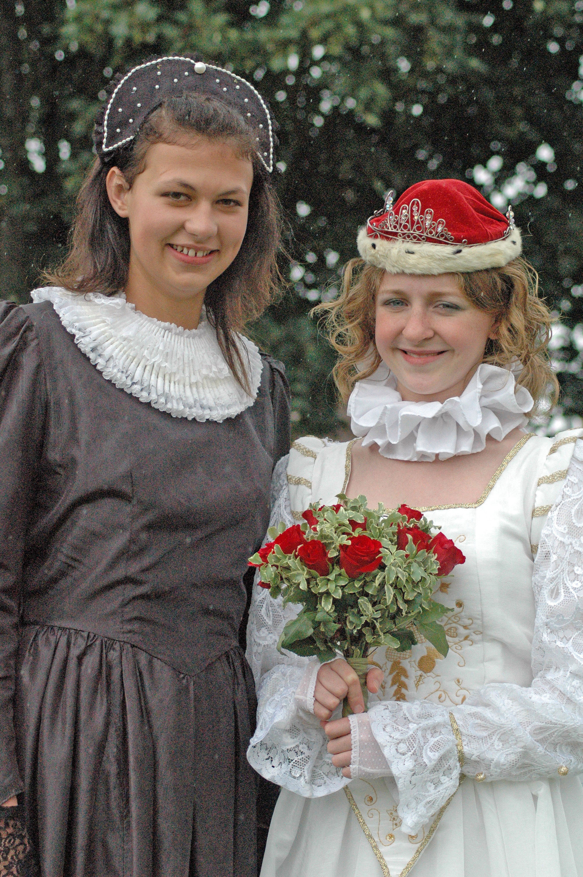 Colour photograph of two young women in historical costumes at the Marymas Fair, 2006.