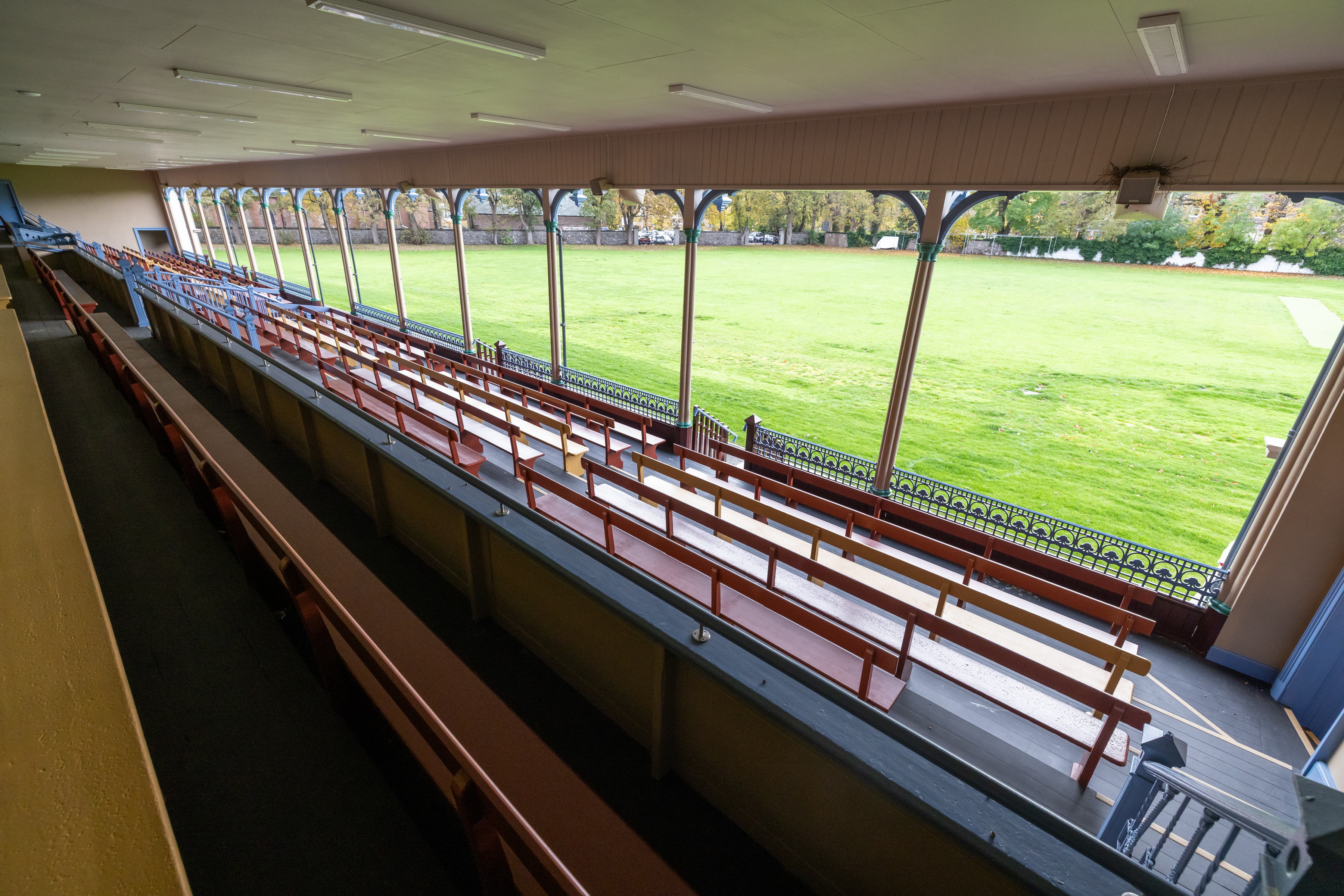 A perspective from within the Grandstand reveals a sweeping view of the expansive green lawn.