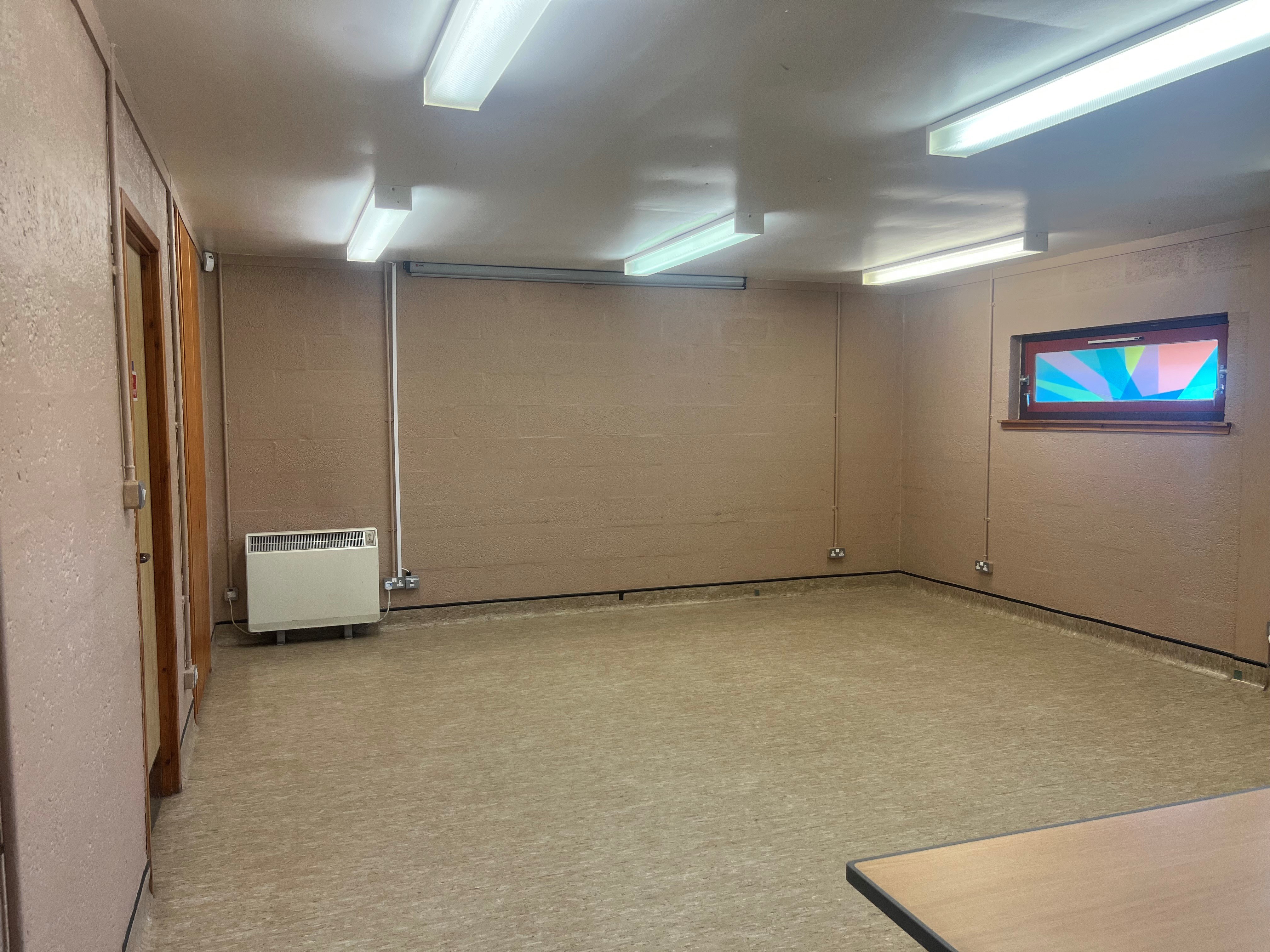 The King Duncans room is a versatile square space that can be configured for various purposes. This photo shows the available empty space.