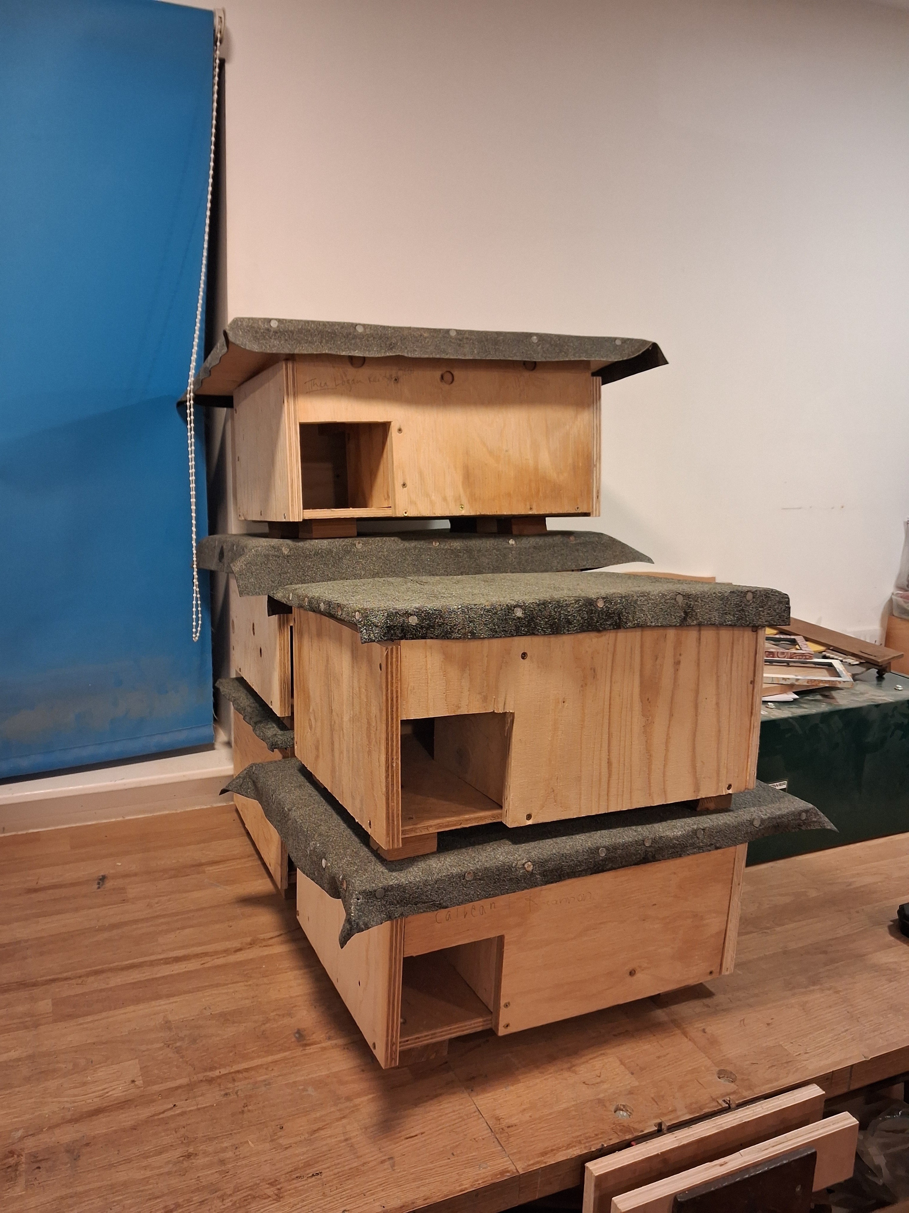A pile of wooden boxes on a desk