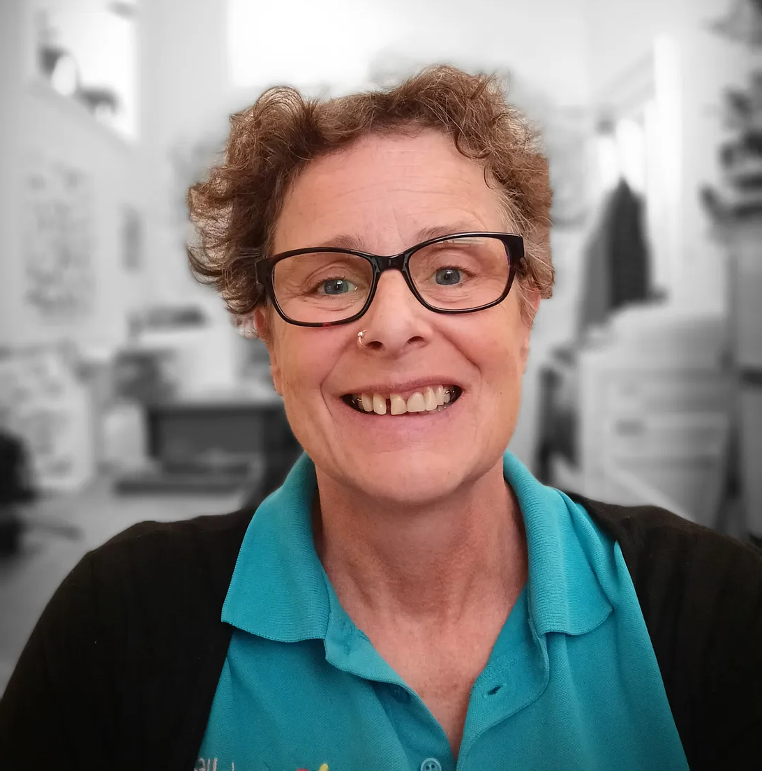 Countryside Ranger in a blue High Life Highland polo shirt indoors with office furniture and equipment in the background.