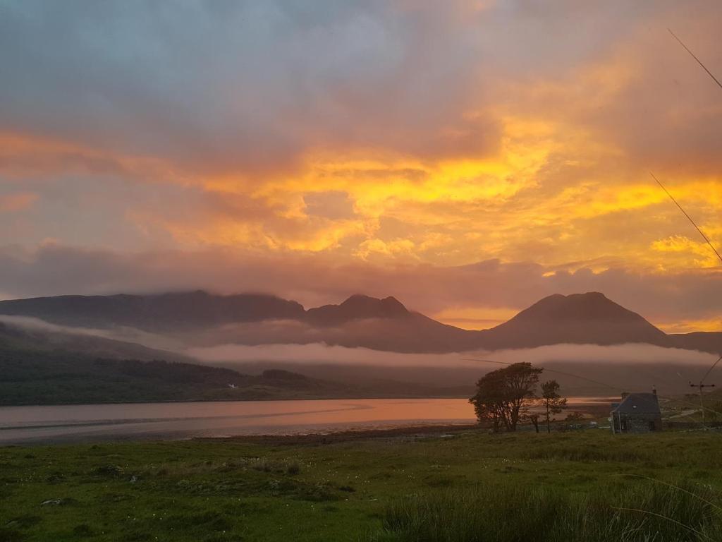 Sunset over the loch and mountains of Skye