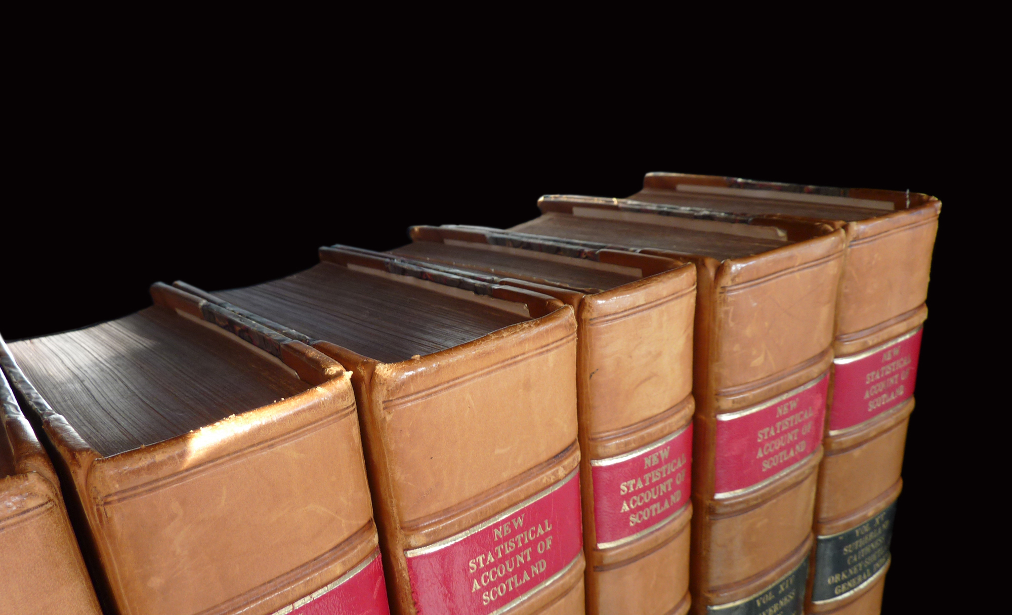 Statistical Accounts of Scotland logo with stylized text on a light brown leather bound books.