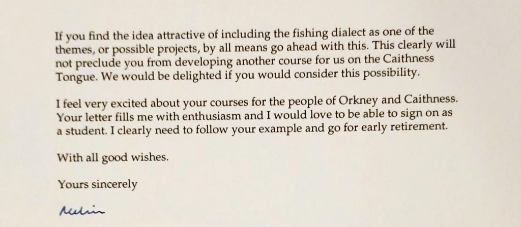 A typed letter excerpt discussing the inclusion of fishing dialect as a theme or project in a course. The text encourages proceeding with the idea and notes it will not prevent developing another course on the Caithness Tongue. The writer expresses enthusiasm for courses aimed at people in Orkney and Caithness, stating the letter fills them with enthusiasm and joking about wanting to sign on as a student and retire early. The letter closes with the phrase “With all good wishes. Yours sincerely” followed by a handwritten signature in blue ink. The layout is simple, with black printed text on white paper.