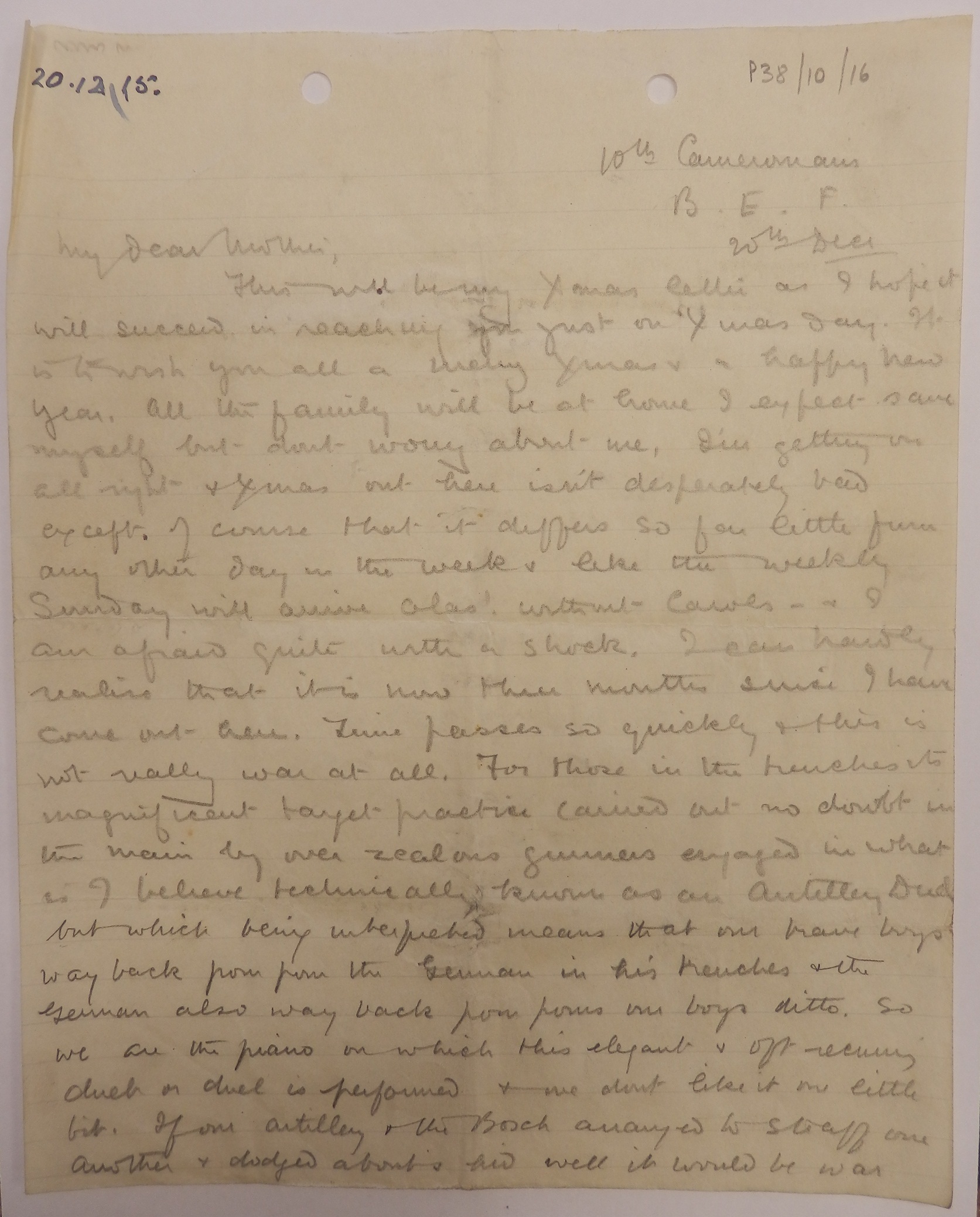 A sheet of brown notepaper with two holes punched in the top, covered in handwriting in pencil.