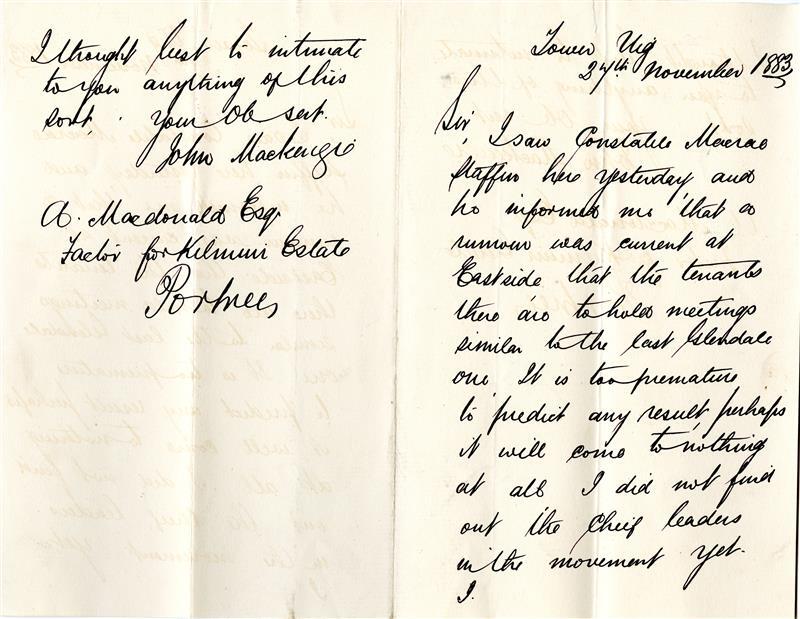 An unfolded sheet of notepaper on which is handwritten a letter in black ink