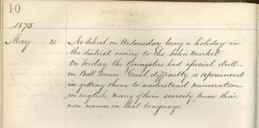 Handwritten school log book entry dated May 21, 1875 noting a holiday for the local market, a ball frame drill, and difficulty teaching English numeration.