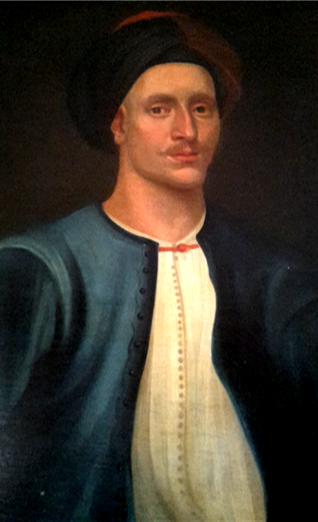 A painted portrait showing the upper body of an individual dressed in historical clothing. The person is wearing a dark blue outer garment with a row of small buttons running down the front edges. Beneath it is a light‑coloured, vertically textured shirt fastened at the neckline with a small red tie or cord. The sleeves of the blue garment are wide and smoothly painted, and the fabric appears heavy and structured. The background is dark and plain, placing emphasis on the clothing and upper torso. A dark head covering or cap is also visible at the top of the image.