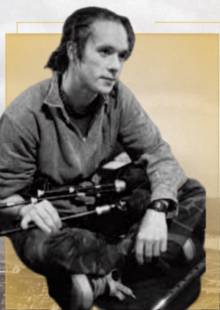 A black-and-white image of a musician holding bagpipes over a historic Skye landscape background.