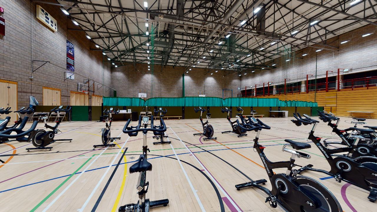 Spin bikes set up in the sports hall at Inverness Leisure