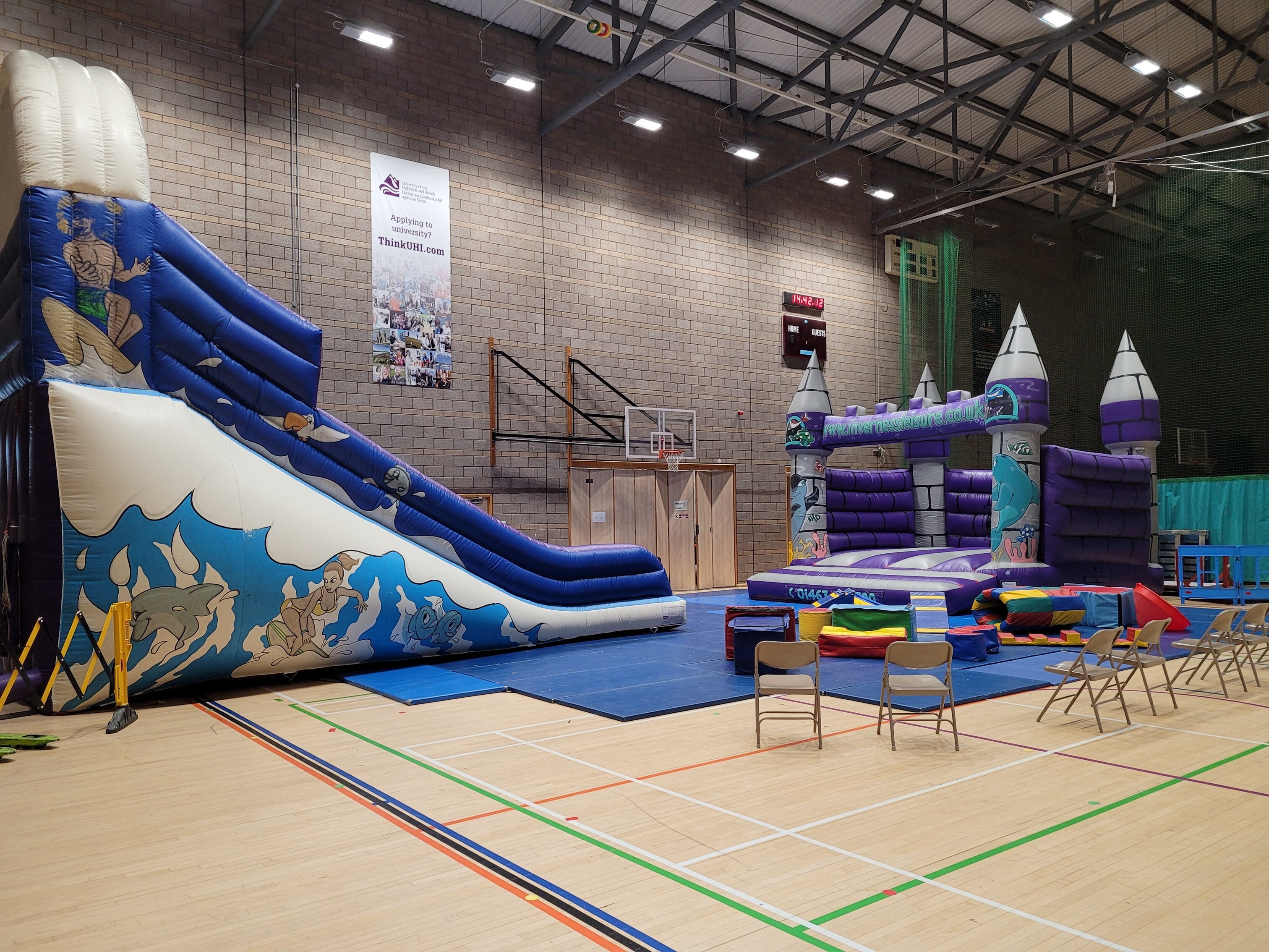 Inflatable play equipment, which includes a slide and a bouncy castle.