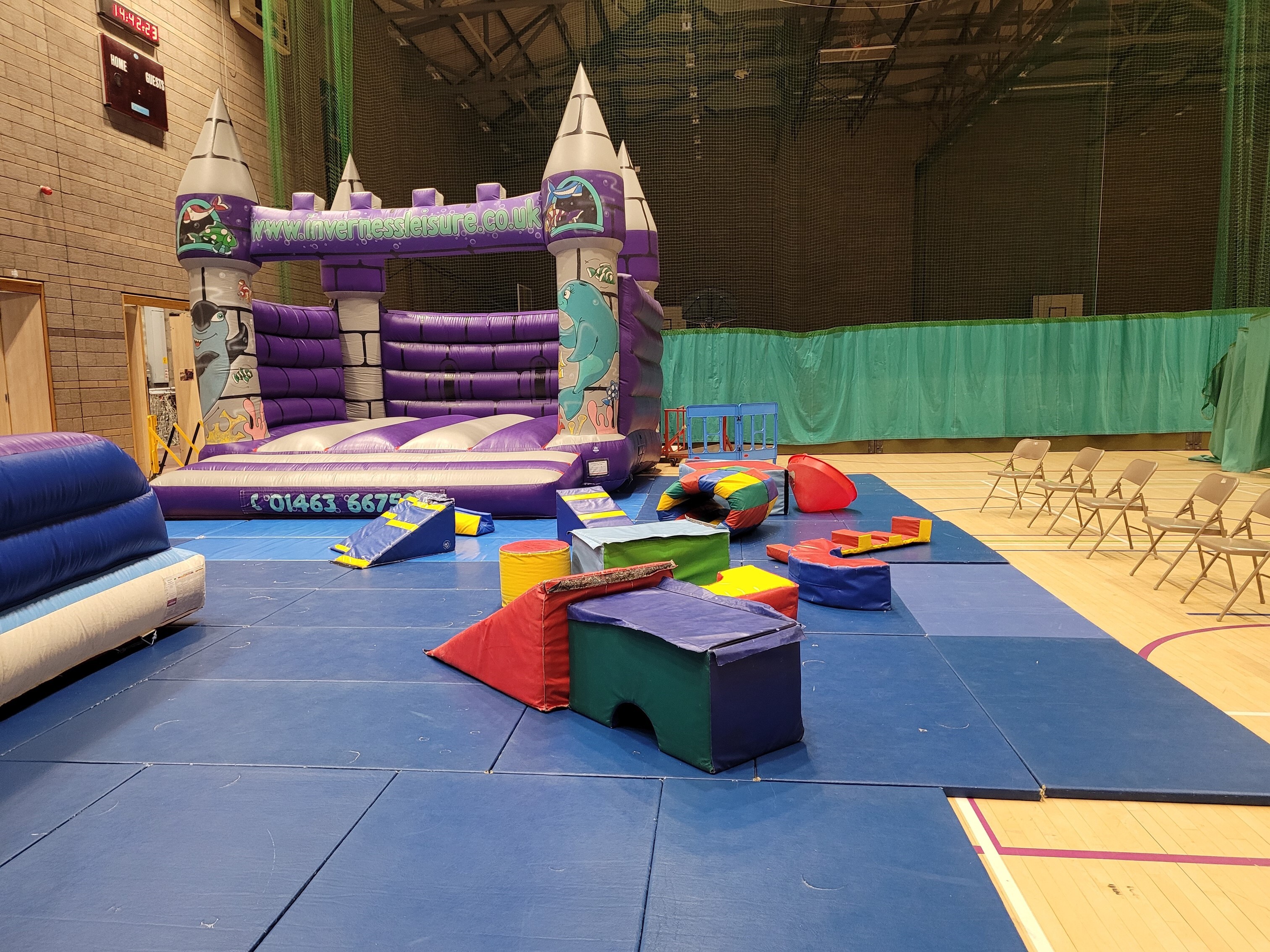 Inflatable play equipment, which includes a bouncy castle.