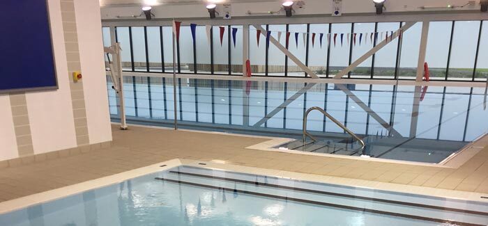 A calm swimming pool ready for people to take the plunge.