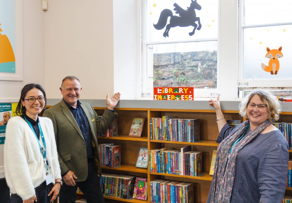Mr Hendry and Inverness Library Staff with Lego sign